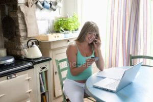 focused_33994589-stock-photo-pregnant-woman-with-laptop